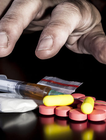 hand reaching for drugs